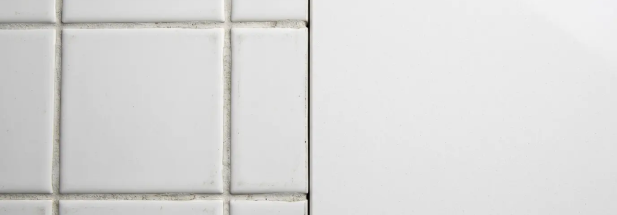 quartz surface vs ceramic tile comparison commercial construction contractor 2026