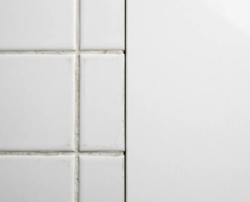 quartz surface vs ceramic tile comparison commercial construction contractor 2026